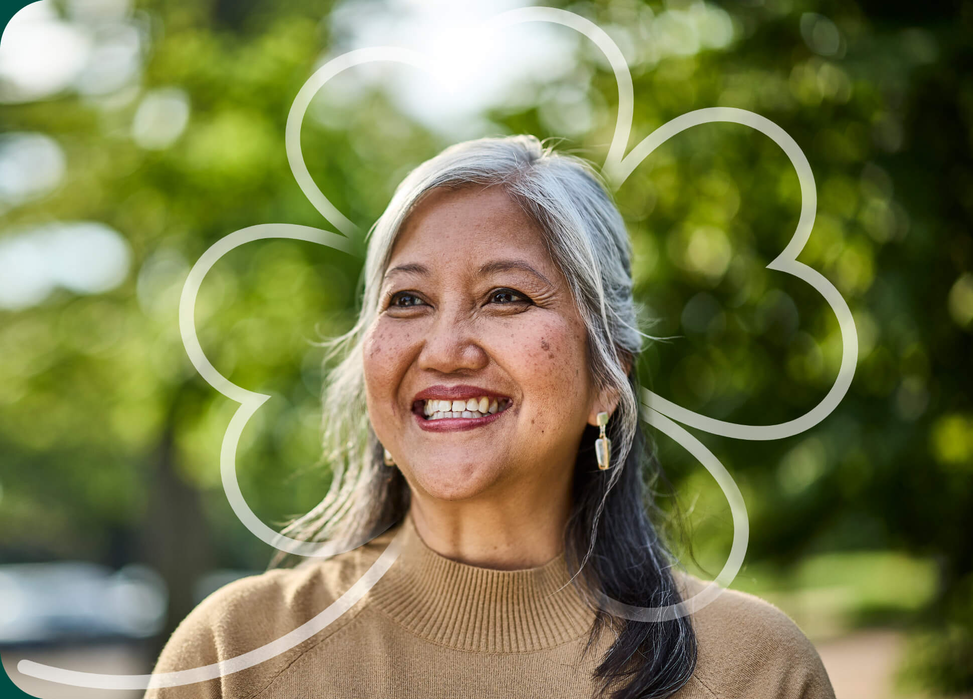 Woman smiling with a clover leaf illustration